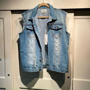 Sleeveless denim jacket with rips